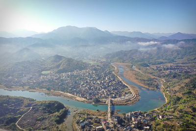 High angle view of townscape and mountains against sky