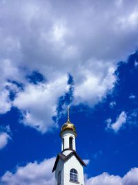 Low angle view of church and building against sky