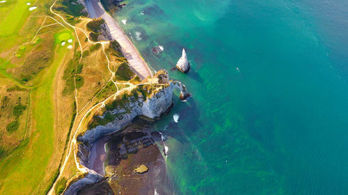 Aerial view of cliff by sea