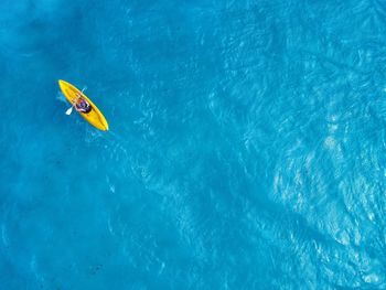 Directly above shot of man kayaking in sea