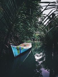 Boat moored on lake