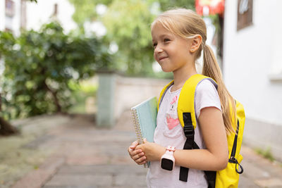 Portrait of a girl standing outdoors