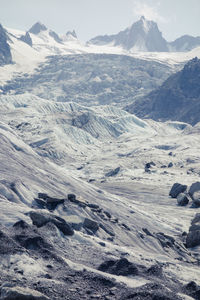 Scenic view of snow mountains against sky