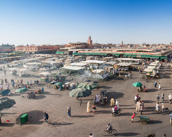 High angle view of people at market in city