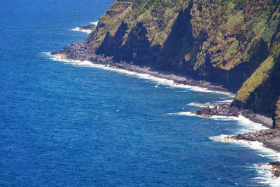 High angle view of sea and rocks