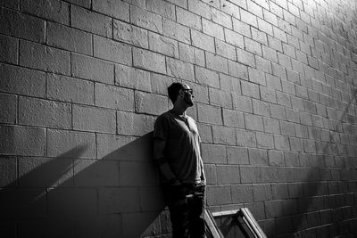 Man standing by wall