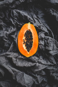 High angle view of orange fruit on bed