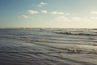 View of calm beach against sky