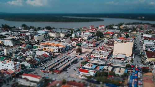 High angle view of city buildings against sky