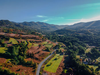 High angle view of trees and mountains against sky