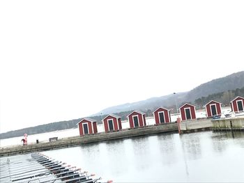 Scenic view of lake against clear sky during winter