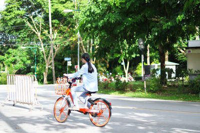 Man riding bicycle on road