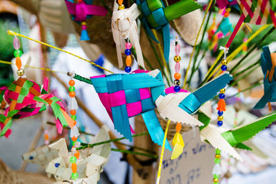 High angle view of toys hanging on paper