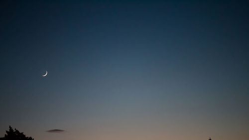 Low angle view of moon in sky