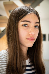 Close-up of young woman at home