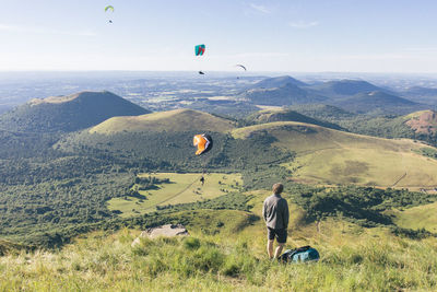 Paragliders at the top of puy-de-dôme in the massif central in summer 