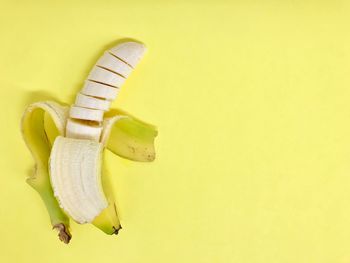 Close-up of fruit against yellow background