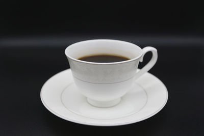 Close-up of coffee cup on table