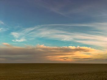 Scenic view of landscape against sky during sunset