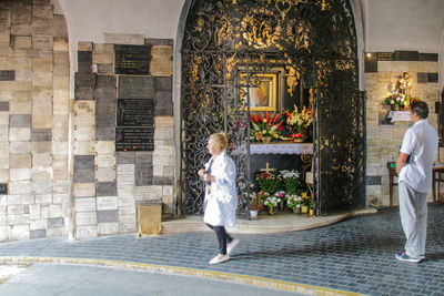 Rear view of people walking in building