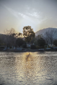 Scenic view of lake against sky during sunset