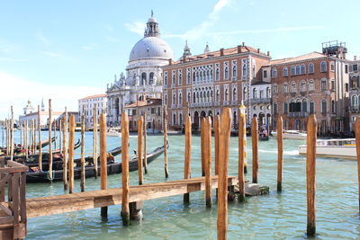 Grand canal by santa maria della salute against sky