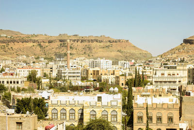 View of residential district against clear sky