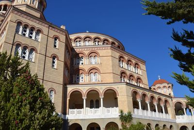 Low angle view of building against blue sky