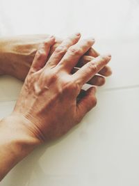 Close-up of hand touching finger