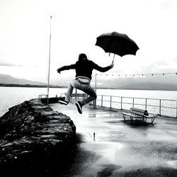 Woman jumping in sea