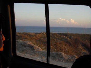 Scenic view of sea seen through airplane window