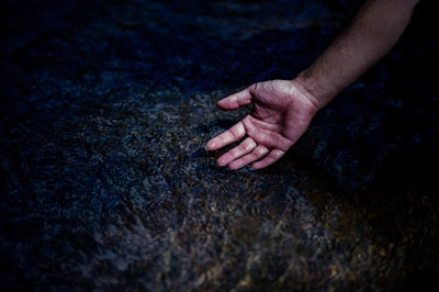 Close-up of hand on rock
