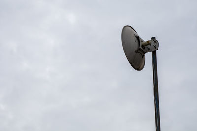 Low angle view of street light against sky