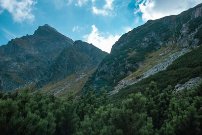 Scenic view of mountains against cloudy sky