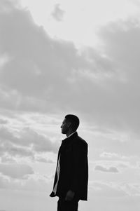 Low angle view of person standing against sky