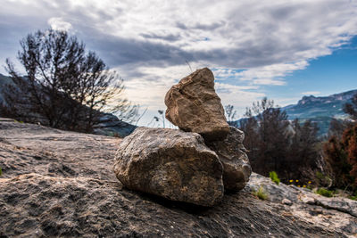 Stones stacked on a rock to mark the path.