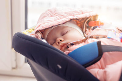 Cute baby girl sleeping at home