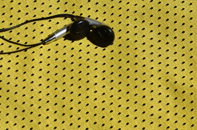 Close-up of earphones on table