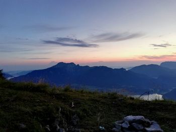 Scenic view of mountains against sky at sunset