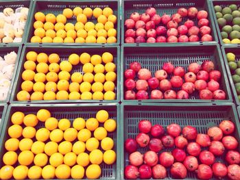 High angle view of fruits in crates for sale in shop