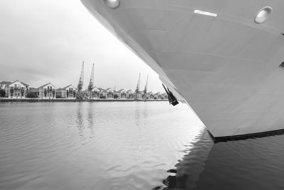 Ship at harbor against sky