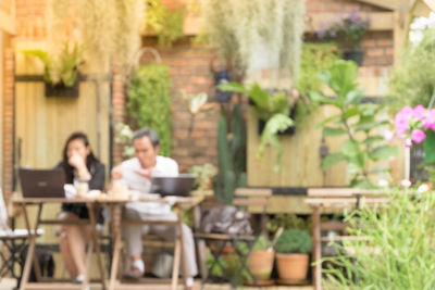 People sitting on chair at table