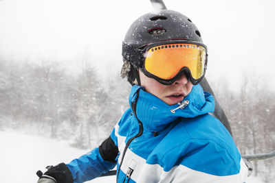 Close-up of man with ski goggles during winter