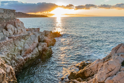 Scenic view of sea against sky during sunset