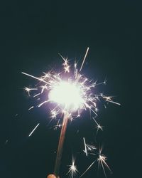 Low angle view of firework display at night