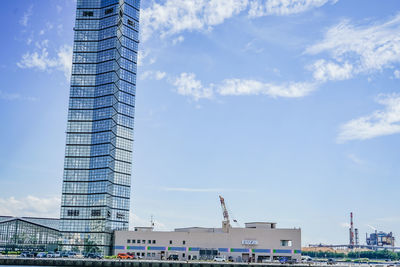 Low angle view of skyscrapers against sky