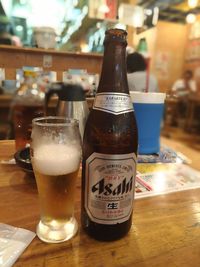 Close-up of beer glass on table