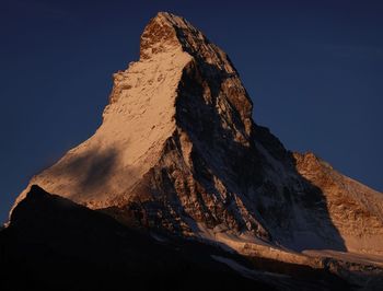 Low angle view of rock formation against sky