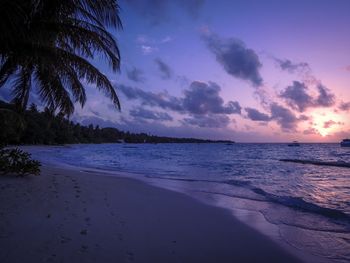 Scenic view of sea against sky at sunset