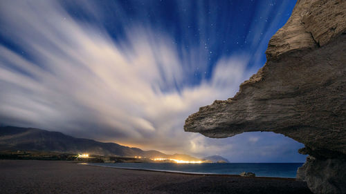 Scenic view of sea against sky at night
